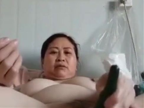 mature chubby Chinese woman with veggie